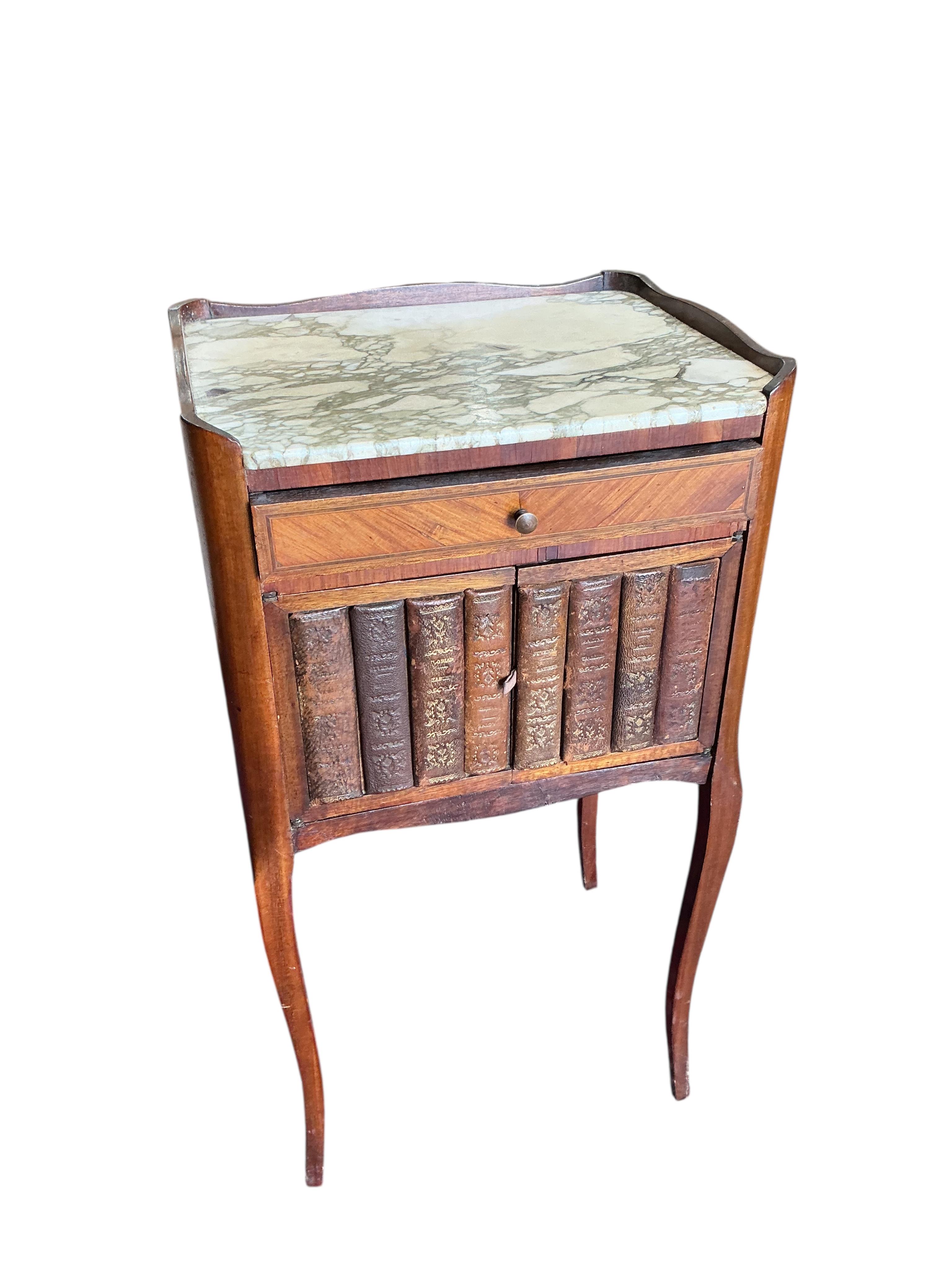A pair of French marble topped kingswood bedside cabinets with faux book spine doors, width 39cm, depth 30cm, height 74cm